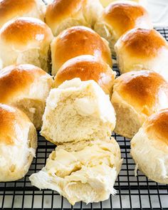 several rolls are cooling on a wire rack