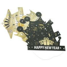 a new year's card with black and gold decorations on the front, and a happy new year banner in the back