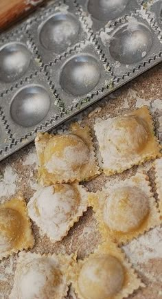 several pastries are sitting on the counter next to a baking pan