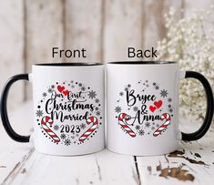 two white coffee mugs with black handles and the words, you've got christmas married on them