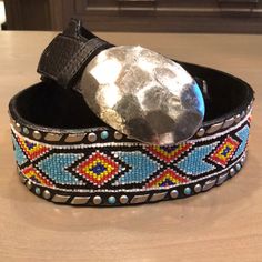 Gorgeous Belt, Hand Beaded With Turquoise And Silver Details. The Buckle Is Sterling Silver. Worn Once, Perfect Condition. Black Leather. 36” Long At Its Longest Setting. 34” At Its Shortest Setting. Crocodile Leather Belt, Silver Wrap Bracelet, Turquoise Wrap Bracelet, Leather Jewels, Embellished Belt, Suede Belt, Beaded Belt, Studded Belt, Purple Rhinestone