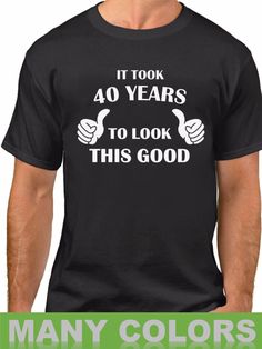 a man wearing a black t - shirt that says it took 60 years to look this good