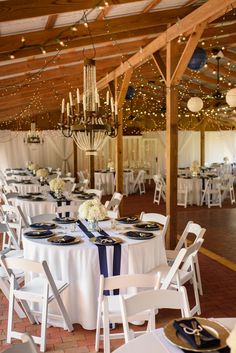 tables are set up with white and blue linens