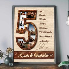 a wooden frame with the number five and photos on it is displayed in front of a wall