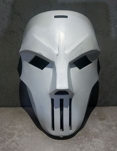 a white mask with black lines on it