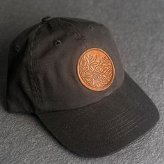 A floral stamped Leather Patch Unstructured Style Hat is the perfect gift for anyone who loves nature. All hats ship for free within the US! SPECS - Leather Patch Color Options: Natural Dublin, Nut Brown Dublin, or Cafe Chromexcel - Hat Color Options: Choose from Stone, Black, Navy, or Gray - All of our products are made to order by hand in McKinney, TX MATERIALS REAL HORWEEN LEATHER: Premium Full-Grain Leather. - Each patch is one-of-a-kind and made from part of a whole hide of leather. There w Adjustable Hats With Leather Patch As Gift, Leather Patch Cap - Gift, Leather Patch Cap As Gift, Leather Patch Cap As A Gift, Leather Patch Cap Hat Gift, Black Dad Hat With Curved Brim As Gift, Brown Curved Bill Hat For Gift, Brown Baseball Cap As Gift, Adjustable Short Brim Baseball Cap As Gift