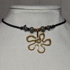 Blue And Gold Ceramic Beaded Wavy Flower Charm Hippie Boho Adjustable Black Rope Cord Choker Necklace Comes On An Adjustable Waxed Black Cord Necklace. Necklace Is Adjustable From Approximately 13" To 22". Adjustable Beaded Flower Pendant Necklace, Adjustable Gold Beaded Flower Necklace, Adjustable Flower Necklace, Black Rope Necklace, Earthy Necklace, Cord Choker, Black Cord Necklace, Rope Cord, Hair Bangs