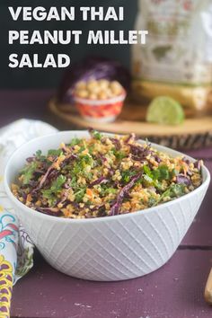 a white bowl filled with rice and vegetables