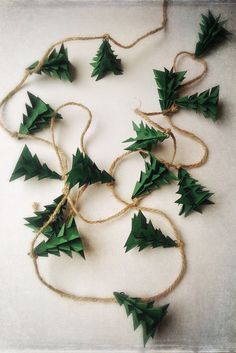 small green christmas trees tied together with twine