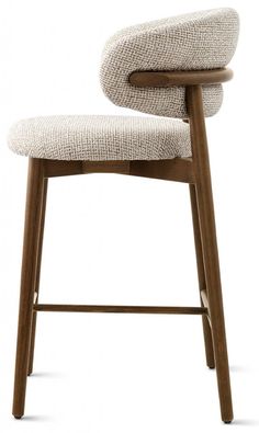 an upholstered stool with wooden legs and a seat cushion on the backrest