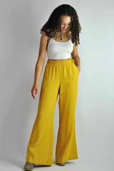 "This is our no. 83 of our Conscious Clothing Concept. This fantastic summer sunny yellow loose fitting elasticated pants are made of pure softened European linen. They are great for a casual style as well as the elegant evening. Very cconfident and elegant summer look. It has got 2 pockets on the back and 2 pockets on the sides. It is the ultimate fabric for hot weather as it breathes and absorbs moisture better that any fabric on earth. This time the fabric is heavier that usual, which makes t Flared Summer Vacation Bottoms, Flare Bottoms For Summer Vacation, Summer Flare Bottoms For Vacation, Summer Vacation Flare Bottoms, Mustard Bottoms With Elastic Waistband For Spring, Mustard Summer Trousers, Mustard Color Summer Trousers, Spring Linen Harem Pants, Linen Full-length Harem Pants For Spring