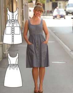 a woman is standing on the side walk wearing a dress with straps and buttons,