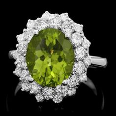 6.30 Carats Natural Very Nice Looking Peridot and Diamond 14K Solid White Gold Ring Total Natural Oval Cut Peridot Weight is: Approx. 4.80 Carats Peridot Measures: Approx. 10 x 12mm Natural Round Diamonds Weight: Approx. 1.50 Carats (color G-H / Clarity SI1-SI2) Ring total weight: Approx. 6.9 grams Disclaimer: all weights, measurements and colors are approximate and may vary slightly from the listed dimensions or as seen in the image. All pictures are magnified to show the smallest of details. P Fine Jewelry Peridot Gemstones For Formal Occasions, Formal Peridot Diamond Ring With Center Stone, Luxury Peridot Ring For Formal Occasions, Oval Peridot Diamond Ring For Formal Occasions, Formal Oval Peridot Diamond Ring, Formal Peridot Diamond Ring With Prong Setting, Peridot Ring For Formal Occasions, Formal Peridot Rings Fine Jewelry, Peridot Rings For Formal Occasions