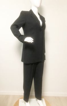 This is a pinstripe suit with high waist pants and a long line jacket. The jacket has a subtle bit of bling along the collar and the breast pocket has a silk square in shades of gray. Both pieces are fully lined. Jacket has light shoulder pads. Polyester and rayon, NWT, unworn condition. Kasper for ASL. Great menswear style with a touch of feminine. Size 8P. Check measurements carefully, no stretch. Measurements taken with jacket and pants laying flat and doubled where appropriate. In order to d Beaded Jacket, Purple Hats, Power Suit, Pinstripe Suit, Pleated Pants, Line Jackets, Boss Babe, We Wear, High Waisted Pants