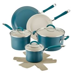 a set of pots and pans with blue handles