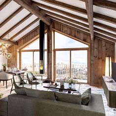 a living room filled with furniture next to a large window covered in wooden planks