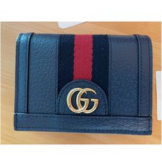 Gucci Ophidia Blue Card Case Gg Foldover Snap Wallet Italy Leather New Gucci Ladies Card Case. Ophidia Series. 523155 Dj2dg 4178 U Card Case (655) Ophidia Dollar Pigprint T/Ns Gucci Blu Agata/Brb 809121920 - 5 Blue Leather Gold Hardware Iconic Blue And Red Stripe Double G Five Card Slots Inside Open Pocket Snap Button Closure Closed: 4.5"W 3.5"H 1"D Made In Italy. Limited Edition - 100% Authentic, Original, New With Tags, Dust Bag, Ready To Ship. Absolutely Brand New. Stunning Piece Of Art Work. Designer Compact Wallets With Card Slots, Designer Compact Wallet With Card Slots, Gucci Leather Wallet With Rfid Blocking, Gucci Leather Wallets With Rfid Blocking, Gucci Bifold Wallet For Everyday Use, Designer Gucci Wallet With Rfid Blocking, Gucci Luxury Wallet With Rfid Blocking, Gucci Luxury Wallets With Rfid Blocking, Classic Gucci Wallets With Card Slots