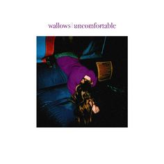 a woman laying on top of a blue couch next to a book cover with the words walls'uncomfortableotable