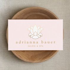 a wooden plate with a business card on it