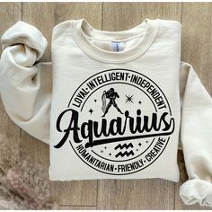 a white sweatshirt with the words aquarius printed on it