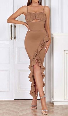 Flatter your figure effortlessly in the Spaghetti Strap Ruffle Midi Dress in Brown. This CB exclusive charms with double shoulder ruffle straps and a tiered ruffle dress. The tea-length hemline hits just below the knees for elongating flair. An easy, breezy style for garden parties and summer soirees!Gentle Dry Clean Only Colour may vary due to lighting on images. The product images (without model) are closest to the true colour of the product.Item runs true to size chart and is cut to suit our Low Main, Symphony Dress, Cutout Neckline, Tiered Ruffle Dress, Ruffle Midi Dress, Evening Gowns Elegant, Dress Spaghetti, Plus Size Kleidung, Easy Breezy