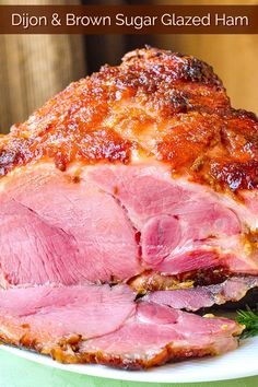 sliced ham sitting on top of a white plate