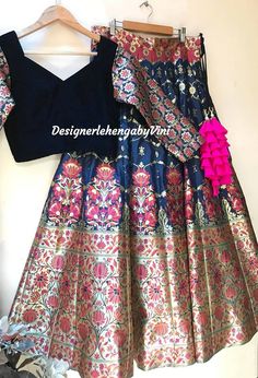 Perfect for Sangeet, engagement and wedding parties. All size available from XS to 5XL Fabric details- Top- Velvet with matching banarasi sleeves Lehenga- Pure Banarasee(Hand woven) Dupatta- Net with sequins. Navy blue in colour. Can also be made in black and bottle green. Dupatta color can be changed. Cancan attached. Fitted Banarasi Silk Lehenga With Meenakari Detail, Fitted Banarasi Silk Lehenga With Meenakari, Designer Meenakari Lehenga For Festivals, Fitted Brocade Lehenga With Meenakari Details, Navratri Brocade Lehenga With Meenakari Detailing, Navratri Brocade Lehenga With Meenakari, Designer Blue Brocade Lehenga, Dola Silk Lehenga With Zari Weaving For Reception, Festive Brocade Lehenga With Unstitched Blouse