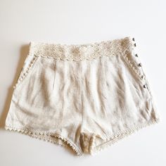 Brand New, Never Been Worn! Multiple Sizes Available! These Linen Beige Shorts Are High Waisted With Two Functional Front Pockets. They Are Not Stretchy And Have 6 Buttons Down The Side So They Can Be Put On Over Hips. Beautiful Crochet/ Lace Details On Waistline, Hemline And Pockets Beige Lace Short Bottoms, Cotton Beach Shorts With Lace Trim, Beige Tie-waist Shorts, Cream High-waisted Cotton Shorts, Beige Lace Trim Shorts, Beige Shorts, Linen Shorts, Beautiful Crochet, Put On