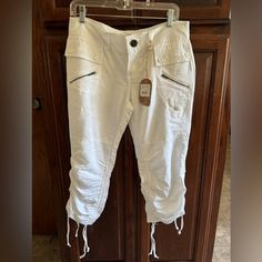 Never Been Worn, Extremely Soft Comfortable Pair Of Capris With Front Zipper Pockets, Back Button Pockets, And Drawstrings On Both Sides Of Legs. Junior Size 9 Which Converts Typically To A Women’s Size 6. Never Been Worn, Has Tags Attached. Casual White Mid-rise Capris, Spring Capri-length Cargo Pants With Pockets, White Ankle-length Cargo Pants With Pockets, White Cotton Full-length Cargo Pants, Cargo Capris, White Fitted Capri-length Bottoms, H&m Trousers, Cotton Capri-length Cargo Pants, Pant Trends