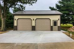 a garage with two doors on the front and one door open to let in light