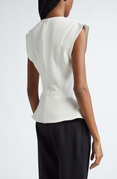 Teensy cap sleeves and a curvy peplum shape this cleanly seamed top carved with a deep V-neck. Hidden back-zip closure Deep V-neck Cap sleeves 70% triacetate, 30% polyester Dry clean Imported Designer Clothing Elegant Tops With Padded Shoulders For Spring, Elegant Spring Top With Padded Shoulders, Elegant Tailored Sleeveless Tops, Elegant Fitted Top With Padded Shoulders, Elegant Fitted Tops With Padded Shoulders, Chic Fitted Tops With Cap Sleeve, Chic Fitted Cap Sleeve Tops, Elegant Structured Tops For Workwear, White Fitted Structured Top