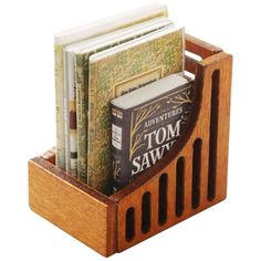 a wooden book holder with books in it