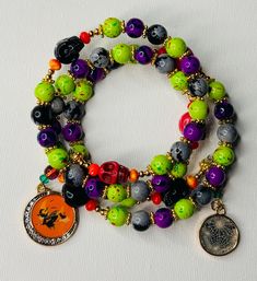 Embrace the spooky season with our Speckled Stone Bead Halloween Charm Bracelet, featuring hauntingly beautiful skull beads. This handcrafted bracelet is a perfect blend of earthy tones and eerie charm, designed to capture the essence of Halloween in a stylish and unique way. The bracelet is made with speckled stone beads that add a natural, textured look, perfectly complementing the detailed skull charms. Each skull bead adds a touch of spooky flair, making this bracelet a must-have accessory for Halloween lovers. Whether you're dressing up for a party or simply want to infuse some seasonal spirit into your everyday look, this bracelet is the perfect choice. Crafted with memory wire, this bracelet offers a flexible, comfortable fit for any wrist size, making it an ideal piece for yourself Handmade Beaded Bracelets For Halloween, Handmade Multicolor Bracelets For Halloween, Halloween Multicolor Beaded Bracelets, Handmade Halloween Festival Bracelets, Handmade Halloween Festival Bracelet, Bohemian Halloween Gift Bracelets, Bohemian Bracelets For Halloween Gift, Adjustable Multicolor Beaded Bracelets For Halloween, Halloween Festival Jewelry With Round Beads