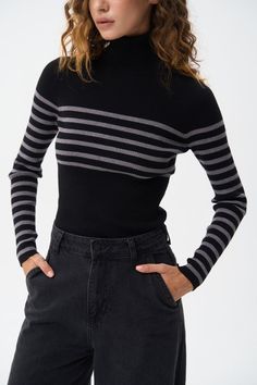 A turtleneck sweater with a milky stripe, combining a classic design with a subtle touch of elegance. The soft, ribbed fabric offers a comfortable fit and keeps you warm, while the milky stripe adds a refined, modern detail. The turtleneck provides extra warmth and a sophisticated look, making it ideal for layering during cooler months. This versatile piece can be effortlessly styled with both casual and formal outfits, adding a chic accent to your wardrobe. Striped Long Sleeve Turtleneck For Winter, Striped Turtleneck Sweater For Layering, Winter Striped Fitted Sweater, Black Horizontal Stripe Winter Sweater, Stretch Striped Ribbed Sweater, Casual And Formal Outfits, Black Turtleneck Sweater, Short Tank Top, Formal Outfits