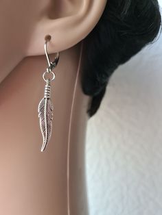 Single feather earring, Feather dangle, Men earring, Symbolic meaning, Silver feather, Silver earring, Gold feather, Gunmetal feather ,for him Earring with lever back hook length 2Inches ( 50 mm ) Charm length 32 mm Earrings are really lightweight and comfortable to wear. Feather Earrings Silver, Gold Feathers, Earring Gold, Silver Feather, Men Earrings, Feather Earrings, Silver Earring, Earrings Collection, Silver Man