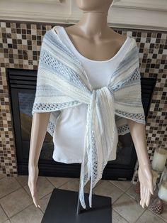 "Vintage style Ice Blue and white lace shawl with white glass beads hand knitted with a blend of hand dyed soft merino wool and silk yarn.  It is very soft and great for cooler months.  Approx 80\"x30\".  Please note that this pattern is also available in other colors and other yarns.  Allow 3-4 weeks per item for shipping.  Price will vary depending on the type of yarn." Elegant Hand Knitted Cream Shawl, Handmade White Lace Shawl, Handmade Lace Shawl In White, Elegant White Crochet Lace Shawl, White Hand Knitted Shawl For Wedding, Hand Knitted White Shawl For Wedding, Elegant White Shawl With Crochet Lace, Elegant Hand Knitted Shawl Scarf, Elegant Hand-knitted Shawl Scarf