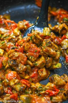 some food is being cooked in a skillet