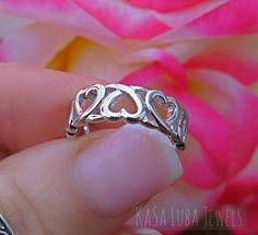 Hearts Love Sterling silver ring sizes 4-11 SOLID sterling stamped 925 silver Tarnish free 4 5 6 7 8 9 10 11 *IF YOUR SIZE ISNT SHOWING, MESSAGE ME. I might be sold out and will be able to replenish shortly* Top of ring height: 6.2mm Band width: 3mm Shank width: 2.4mm This is a High Polished solid sterling silver ring with Rhodium plating to prevent tarnishing. Nothing but the best from my custom jewelry store. --------------------------- Please follow care instructions. Any rings with stones, r Nickel-free Heart Ring For Valentine's Day, Adjustable Heart Toe Ring For Promise, Silver Heart Ring For Mother's Day Promise, Hypoallergenic Promise Ring For Valentine's Day, Nickel-free Sterling Silver Rings For Valentine's Day, Silver Midi Rings As Valentine's Day Gift, Silver Midi Rings For Valentine's Day Gift, Hypoallergenic Rings For Anniversary On Valentine's Day, Hypoallergenic Heart Ring For Anniversary On Valentine's Day