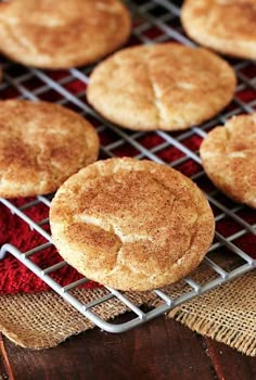 baked biscuits cooling on a wire rack with burlied cloth and red towel in the background