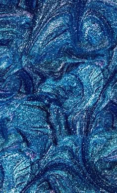 an abstract blue background with lots of small swirls and bubbles in the middle,