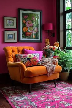 a living room with pink walls, orange chair and potted plants in the corner