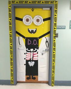 a door decorated to look like a minion with the words do it on it