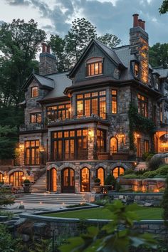 a large house with many windows lit up at night