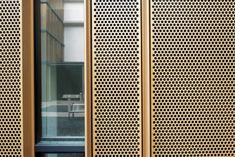 a room divider made out of wood with perforsants on the sides