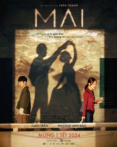 two people standing in front of a poster for the movie maa, which is being directed by chinese film director huang tet