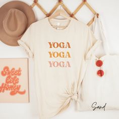 Yoga Yoga Yoga Shirt, Yoga Shirt, Yoga Gift, Yoga Gift for Her, Yoga Lover Gift, Meditation Shirt, Namaste Shirt Hi there! Welcome to Ruby Rae Tees, I'm so happy you stopped by! At Ruby Rae Tees, I offer high quality sweatshirts, long sleeves, t-shirts, youth t-shirts, toddler t-shirts, and infant onesies. All of my shirts are designed and printed in the USA. Please continue reading to find out more important information before ordering.  HOW TO ORDER .... 1. Review all product photos 2. Choose size and color. All of our items are unisex, so I recommend sizing up for an oversized look and down for a fitted look.  3. Please click add to cart. You will need to repeat the process for each item that you'd like to order.  4. Then proceed to checkout and your items will ship in 1-3 days. You can Sporty Yoga T-shirt With Letter Print, Relaxed Fit Yoga T-shirt With Letter Print, Cotton Athleisure T-shirt For Light Exercise, Cotton Yoga Activewear, Cotton Short Sleeve Activewear For Yoga, Cotton Moisture-wicking T-shirt For Yoga, Moisture-wicking Cotton T-shirt For Yoga, Stretch Cotton Yoga T-shirt, Sporty Letter Print Tops For Yoga