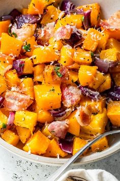 a white bowl filled with chopped up vegetables