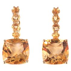 Such a fun dangle style! The round and cushion-cut citrines are a great combination with the 18 karat, yellow gold, pierced mounting! The total stated weight of all of the citrines is 9.10 carats. Yellow Diamond Earring, Yellow Gold Diamond Earrings, Pave Diamond Earrings, Fancy Yellow Diamond, Diamond Collection, Citrine Earrings, Yellow Gemstones, Gold Diamond Necklace, Diamond Earring