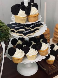 cupcakes and cookies are stacked on top of each other in the shape of mickey mouse