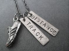 two necklaces with words on them that say,'stepple track'and'running shoe '